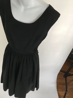 "1950's/60's heavy black dress with bolero jacket with rhinestone swirls at the collar. In mint condition Size XS: 23\" waist and 33\" bust Measurements: Dress B: 33\" W:23\" H: free Shoulder to waist: 16\" Waist to hem: 26.5\" Jacket/ Bolero Bust from edge to edge: 40\" Hem from edge to edge: 38\" Sleeve length: 21.5 Sleeve circumference: 16.5\" around" Retro Black Cocktail Dress, Black Dress With Fitted Bodice For Vintage Events, Vintage Style Black Party Dress, 1950s Style Black Cocktail Dress, Black 1950s Style Cocktail Dress, Chic Black Vintage Dress For Party, Fitted Black Vintage 1950s Style Dress, 1950s Style Fitted Black Vintage Dress, Black Fitted Vintage Dress In 1950s Style