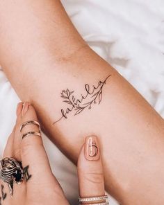 a woman's legs with a tattoo on her left leg and the word love written in cursive writing