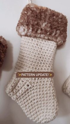 a crocheted stocking with the words pattern update on it and two teddy bears next to it