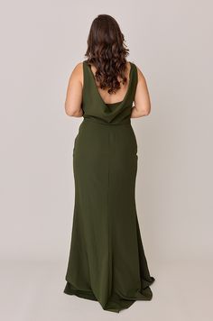 the back of a woman in a green dress