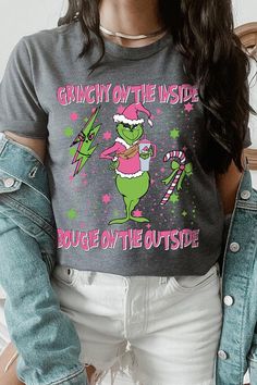 Embrace your inner 'Grinchy' side with a touch of 'Bougie' flair in this latest Christmas unisex short-sleeved tee. This playful graphic tee captures the holiday spirit with a twist, featuring a catchy slogan that reads 'Grinchy on the Inside, Bougie on the Outside.' Made from a comfortable blend of materials, this sweatshirt is both soft to the touch and durable for the winter season. Its unisex design ensures a great fit for everyone, making it a perfect gift or festive wardrobe staple. Proudl Fun Winter T-shirt With Crew Neck, Relaxed Fit Short Sleeve T-shirt For Holiday, Trendy Christmas T-shirt Crew Neck, Trendy Christmas Crew Neck T-shirt, Fun Winter Crew Neck T-shirt, Fun Crew Neck T-shirt For Winter, Winter Short Sleeve Tops With Letter Print, Short Sleeve Tops With Letter Print For Winter, Short Sleeve Graphic T-shirt For Winter