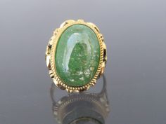 Vintage 18K Solid Yellow Gold Cabochon Green Quartz Ring....Marked 18k ...Total of weights 9.5grams...Size 7.75..Measure of stone 17.5 x 12.3MMIt's in very good condition. #461048 Gold Ring With Large Oval Cabochon Stone, Gold Gemstone Cabochons For Anniversary, Gold Polished Cabochons For Anniversary, Gold Emerald Ring With Large Oval Stone, Gold Oval Opal Ring With Stone Setting, Oval Gold Opal Ring With Stone Setting, Oval Gold Emerald Ring With Stone Setting, Gold Emerald Cabochon Ring Gift, Green Quartz