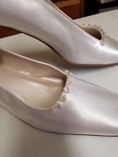 "Beautiful elegant pump style shoes, for the minimalist bride who loves chic shoes! HEEL square, as shown in white: 1 1/2\" If, you prefer the champagne pictured heels (up to size 12, 12W) please click on link below: www.etsy.com/listing/703287418/gold-pump-shoesgolden-anniversary? Please look at the pictures for details such as the gold tone bling brooches adding a very special Elegant & Chic touch. COLOR AVAILABLE: Champagne, Silver, White, Off-White, Ivory SIZES AVAILABLE: M (Medium width Classic Flat Heel Wedding Shoes, Classic Pointed Toe Kitten Heels For Wedding, Classic Kitten Heels With Pointed Toe For Wedding, Classic Cream Closed Toe Wedding Shoes, Classic Closed Toe Wedding Court Shoes, Classic Closed Toe Court Shoes For Wedding, Classic Round Toe Wedding Court Shoes, Classic Wedding Court Shoes With Round Toe, Classic Cream Almond Toe Wedding Shoes