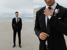 a man in a suit and tie standing on the beach