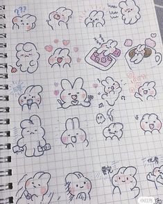 an open notebook with various stickers on the pages and in front of it are drawings of animals