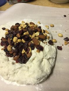 the dough has nuts and raisins on it