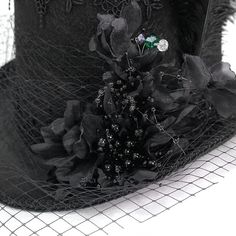 A gothic top hat with mesh and feathers.The hat is additionally decorated with various laces, fishnet and beads. Product Specifications:Style: GothicFabric: 100% Polyester Abandoned Carnival, Gothic Tops, Fashion Now, Top Hat, Feathers, Carnival, Mesh, Beads, Lace