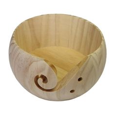 a wooden bowl with a spiral design on it