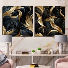 two black and gold paintings in a living room