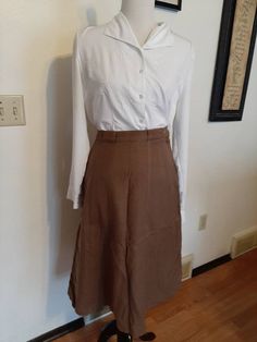 "Mid Century Womens Office/Career Wool A-Line/Pencil Skirts Size S-M/Vtg Lot 4 Wool Skirts Very Good Wearable Condition. Came From An Estate Sale And Need To Be Cleaned From Being Stored. Knee Length Or Slightly Longer Depending On Height. Fairly Soft Wool Fabric/Not Scratchy Lavender Lined Kerrybrooke Pencil Skirt Wool/Acetate Lining 1\" Waistband/Lavender 7\" Side Metal Zipper/1 Button Top Stitching and Front Kick Pleat (1 Tiny Hole Inside Pleat) Waist 27\" Hips 40\" length 26\" Black/Cream/Gr Vintage Long Skirt With Relaxed Fit, Retro Long Lined Skirt, Retro Skirt For Workwear, Retro Lined Skirt For Daywear, Retro Fitted Skirt For Daywear, Retro Long Skirt With Lining, Fitted Retro Skirt For Daywear, Retro Skirt For Spring Workwear, Vintage Flared Skirt Bottoms For Fall