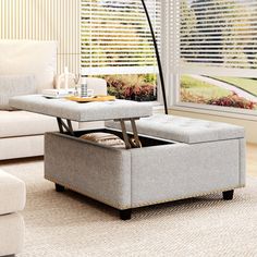 a living room scene with focus on the footstool and storage bench in the middle