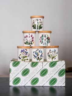 a stack of flower pots sitting on top of a box