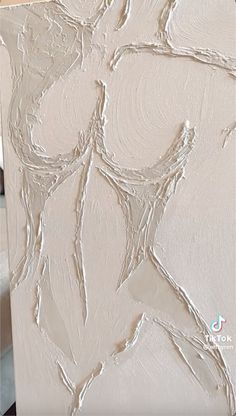 an abstract painting with white paint on it