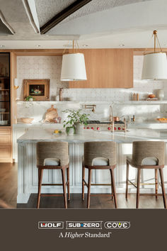 an image of a kitchen setting with bar stools and island in the center area