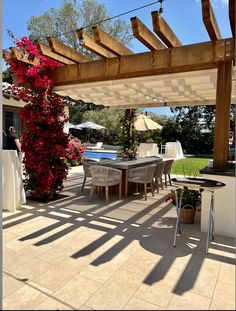 Tan waterproof fabric retractable canopies added to outdoor pergola Pergola Fabric Shade, Spanish Style Pergola Patio, Wood Pergola With Retractable Canopy, Trellis Patio Cover, Pergola With Shade Cloth, Pergola Retractable Shade, Pergola Shade Ideas, Outdoor Patio Pergola