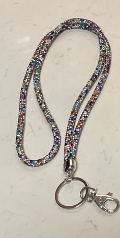 Turn your ID into a dazzling accessory with our Bling Rhinestone Lanyard. Sparkle in style as you carry your essentials - because your everyday can be extraordinary! A shiny Retractable ID Holder is included! Lanyard may pull on hair. Please allow glue to dry on the lanyard by hanging, while not in use. Be Extraordinary, Round Rock, Id Holder, Badge Holders Lanyard, Badge Holders, Lanyard, Glue, Multi Color, Sparkle