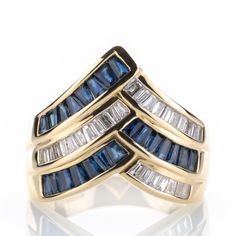 This piece from the late 20th century combines boldness with elegance. This is achieved through the solid yet graceful design crafted from heavy yellow gold, elegantly combining sapphires and baguette-cut diamonds. Metal 14k / 0.585 gold Gemstones 22 sapphires 0.70ct 21 diamonds 0.50ct Measurements Head 16.5mm Shank 4.2mm Ring size 7 US / 54 EU Weight 5.6g Condition Pre-owned, very good conditions   General Information All items come with certificate of authenticity, gemstones have been tested a Yellow Gold Sapphire Ring With Baguette Diamonds, Baguette Cut Diamond, Fabulous Jewelry, Pretty Rings, 14k Gold Ring, Late 20th Century, Multi Stone Ring, Multi Stone, Pretty Jewellery