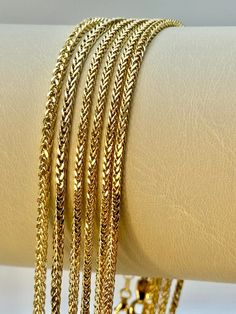 18k Gold Foxtail Necklace ,27.5",2.5mm, 7.70 gr 18k Gold Foxtail Necklace ,25.5",2.5mm, 7.14 gr 18k Gold Foxtail Necklace ,23.5",2.5mm, 5.98 gr 18k Gold Foxtail Necklace ,21.5",2.5mm, 5.79 gr 18k Gold Foxtail Necklace ,16.5",2.5mm, 5 gr This is a Trending Etsy Bestselling Franco Necklace. It is made with Authentic Genuine Real 18K Gold. Easy to layer! Looks beautiful with your favorite charms or even if you wear it alone. BEST PRICE ON ETSY FOR SOLID 18kGOLD FRANCO NECKLACES! Premium spring ring Gold Wheat Chain Necklace For Anniversary, Yellow Gold Herringbone Necklace With Snake Chain For Anniversary, Gold Multi-strand Figaro Chain Jewelry, 14k Gold-filled Jewelry With Figaro Chain, Yellow Gold Figaro Chain Rope Necklace Gift, 14k Gold-filled Figaro Chain Necklace As Gift, Luxury Gold-plated Figaro Chain Necklace, Real Gold Chains, Real Gold Jewelry