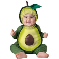 a baby dressed in an avocado costume