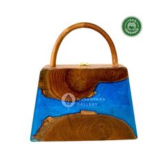 Nusantara Aqua Handmade Wooden Teakwood Handbag, Women Top Handle Bag with Epoxy Resin, Anniversary Gift, Evening Bag, Gift for Her Materials: Teak Wood, Epoxy Resin, Premium Gail for Inner 📐Dimensions: Length: 24 cm / 9.4" Width: 6.5 cm / 2.6" Height: 25 cm / 9.8" 👜 Unique Design: One pattern for each handbag. The item received will have a different pattern from the picture since it's a natural wood. ✨ These wooden bags are made by hand, which means more attention to detail and higher quality Rectangular Bag With Bamboo Handle As Gift, Rectangular Bags With Bamboo Handle For Gift, Rectangular Bag With Bamboo Handle For Gift, Bamboo Handle Tote Bag As Gift, Gift Handheld Shoulder Bag With Bamboo Handle, Gift Bamboo Handle Handheld Shoulder Bag, Handheld Shoulder Bag With Bamboo Handle As Gift, Bamboo Handle Tote Bag For Gift, Natural Bag With Bamboo Handle As Gift