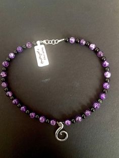 handmade beaded choker. Includes a green girl studios silver swirl charm and amethyst and obsidian beads. Purple Beaded Necklace With Black Beads For Gift, Purple Necklace With Black Beads For Gift, Gift Purple Necklace With Black Beads, Swirl Necklace, Princeton Nj, Green Girl, Beaded Necklaces, Beaded Choker, Necklace Etsy