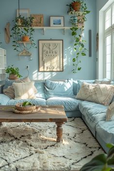 a living room filled with lots of furniture and plants on the wall above it's couch