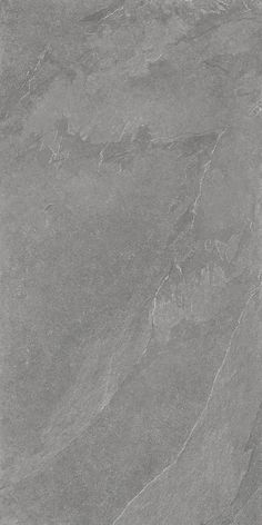 a black and white photo of a marble floor with grey veining on the surface