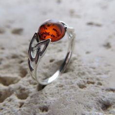 This is a beautiful Baltic Amber Ring in .925 Sterling Silver.  The Amber is right from the capital of amber and silver: the city of Gdańsk / Danzig in Poland. The ring is made out of solid 925 Silver and there is no nickel or other substances causing most allergies in the silver. This makes the ring hypo allergenic. Size of the Amber 0.8 x 0.8 cm 0.41 x 0.41 inch Weight of the Ring 2.1 grams 0.07 oz You will receive the item in a gift box - perfect to surprise someone or yourself. Usually we sh Amber Engagement Ring, Pretty Engagement Rings, Amber Ring, Handcrafted Artisan Jewelry, Silver Engagement Rings, The Capital, Baltic Amber, Artisan Jewelry, Cognac