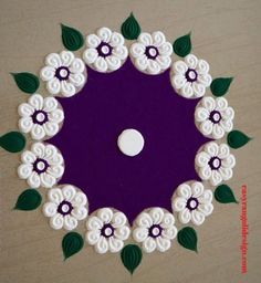 a purple and white flower design with green leaves