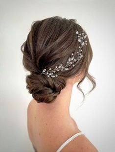 a woman wearing a bridal hair piece