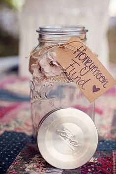 a mason jar filled with lots of stuff on top of a table