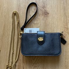 Brand New Nordstrom Exclusive Coach Mini Bag With Wristlet Strap And Gold Chain Crossbody Strap. Black Pebbled Leather With Gold Hardware. Main Pouch Has A Zip Closure And Slip Pockets On The Front And Back Are Secured Using The Turn Lock Closure. Measures Approx 7”L X 4”H X 1.5”D Please Use Offer Button. Coach Clutch With Removable Pouch For Evening, Coach Evening Clutch With Removable Pouch, Coach Clutch With Removable Pouch For Formal Occasions, Coach Clutch With Removable Pouch, Coach Wallets With Chain Strap For Everyday Use, Black Coach Wallet With Detachable Strap, Coach Crossbody Clutch For Evening, Coach Evening Clutch Crossbody, Evening Clutch With Detachable Strap By Coach