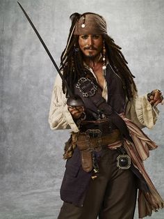 a man dressed as captain jack sparrow with two swords in one hand and an eye patch on the other