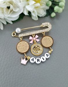 "Quran Surah Pins, Silver or Gold Allah Pin Brooch, Child Protection Islamic Dua, Personalized Allah Ayatul Kursi Four Qul Muslim Eid Gifts Note‼️ Due to the global pandemic there may be a delay in delivery. Hoping for your understanding and patience. Stay safe and well! This is a beautiful baby pin featuring the diamante Allah and Ayatul Kursi / 4quls pendants and a baby name boy or girl. 18k gold plated with Swarovski crystals and cute bow. Please leave the personalization details in the \"Not Personalized Safety Pin Gift, Personalized White Pins For Gifts, Personalized Gold Pins For Gifts, Personalized Gold Brooches As Gifts, Gold Safety Pin Jewelry For Wedding, Personalized Gold Wedding Pins, Newborn Baby Boy Gifts, Muslim Eid, Ayatul Kursi