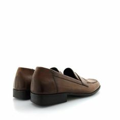 Step up your style game with these Cole Haan Men's Brown Penny Loafers. Crafted with premium leather, these slip-on shoes are perfect for work or dress occasions. With a comfortable fit and timeless design, you'll feel confident and stylish all day long. Don't miss out on this very good condition pair, grab them now! Business Brown Slip-ons With Leather Lining, Brown Semi-formal Slip-ons With Rubber Sole, Brown Slip-on Tassel Loafers For Formal Occasions, Classic Brown Plain Toe Slip-ons, Modern Brown Loafers With Brogue Detailing, Classic Brown Leather Slip-on Shoes, Brown Moc Toe Slip-ons With Brogue Detailing, Brown Moc Toe Classic Slip-ons, Modern Brown Loafers For Business Casual