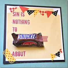 a candy bar on top of a card that says sin is nothing to snickk about