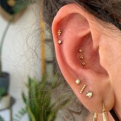 a woman with ear piercings on her ears