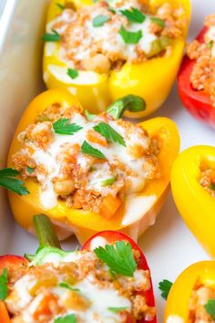 stuffed bell peppers with cheese and herbs in a baking dish, ready to be eaten