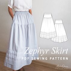 a woman wearing a skirt and top with the sewing pattern on it, standing in front of a wall