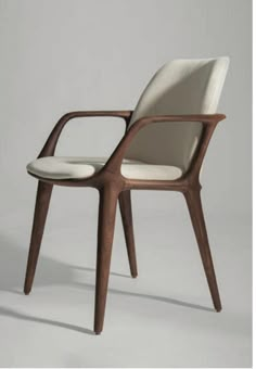 a white chair with wooden legs and arms