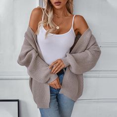 Embrace the cozy vibes of autumn and winter with our Women's Solid Color Knitted Sweater Cardigan. This mid-length cardigan is the ultimate layering piece for the chilly season, crafted from a soft, breathable fabric that provides both warmth and comfort. The loose fit allows for effortless style and versatility, making it easy to throw on over your favorite tops or dresses. Available in a range of solid colors, this cardigan can be easily paired with jeans, leggings, or skirts for a chic, casual look. Its simple yet elegant design features an open front and relaxed sleeves, offering a laid-back aesthetic that's perfect for any occasion. Whether you're enjoying a leisurely day at home or heading out for a casual outing, this knitted cardigan will keep you stylish and snug. Elevate your aut Loose Knit Sweater, Loose Fit Sweater, Long Sleeve Knitted Cardigan, Knitting Women Cardigan, Cardigan Sweater Coat, Loose Knit Sweaters, Loose Knit, Crop Top Sweater