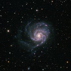 an image of a spiral galaxy in the sky