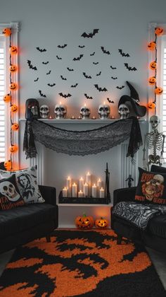 a living room decorated for halloween with candles and decorations