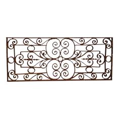 a decorative iron grille with swirls and circles on the top, against a white background