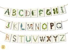 the letters are made up of different types of plants and leaves, with some hanging from strings