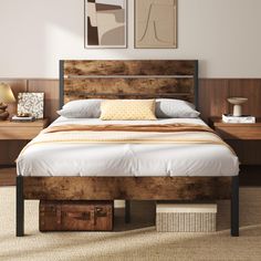 a bed sitting in a bedroom next to two framed pictures on the wall above it