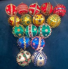 an assortment of christmas ornaments on a blue surface