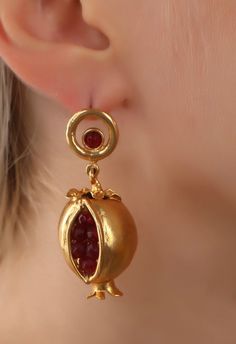 Handmade earrigns made out bronze ,plated by 18K-24K gold,Oxidized to have a unique historical The needle part is made out silver to avoid allergy. Ottoman earring pomegranate is very beautiful, it has a meaning of health and abundance, it is a museum earring. Gold Garnet Earrings For Wedding, Traditional Jewel Earrings For Gift, Traditional Jeweled Earrings For Gifting, Traditional Jeweled Earrings As Gift, Traditional Jeweled Earrings For Gifts, Antique Jeweled Earrings For Gift, Pomegranate Earrings, Pomegranate Design, Wrap Earrings