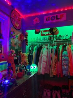 a room filled with lots of clothes and toys in it's neon lighting display