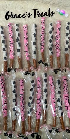 pink and black zebra print toothbrushes in cellophane bags with the words grace's treats written on them